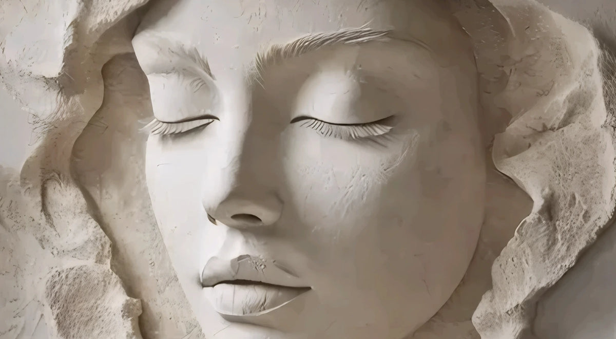Ivory Stillness original artwork showing a serene feminine face with an ivory stone effect